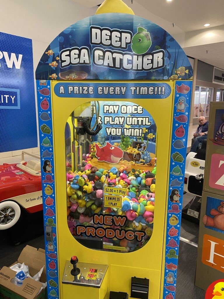 Another Rubber Duck claw machine at College Square Mall. This one is $2.00 and play till you win. It took me a bit with this one, but I did win a Mohawk rubber duck. ​