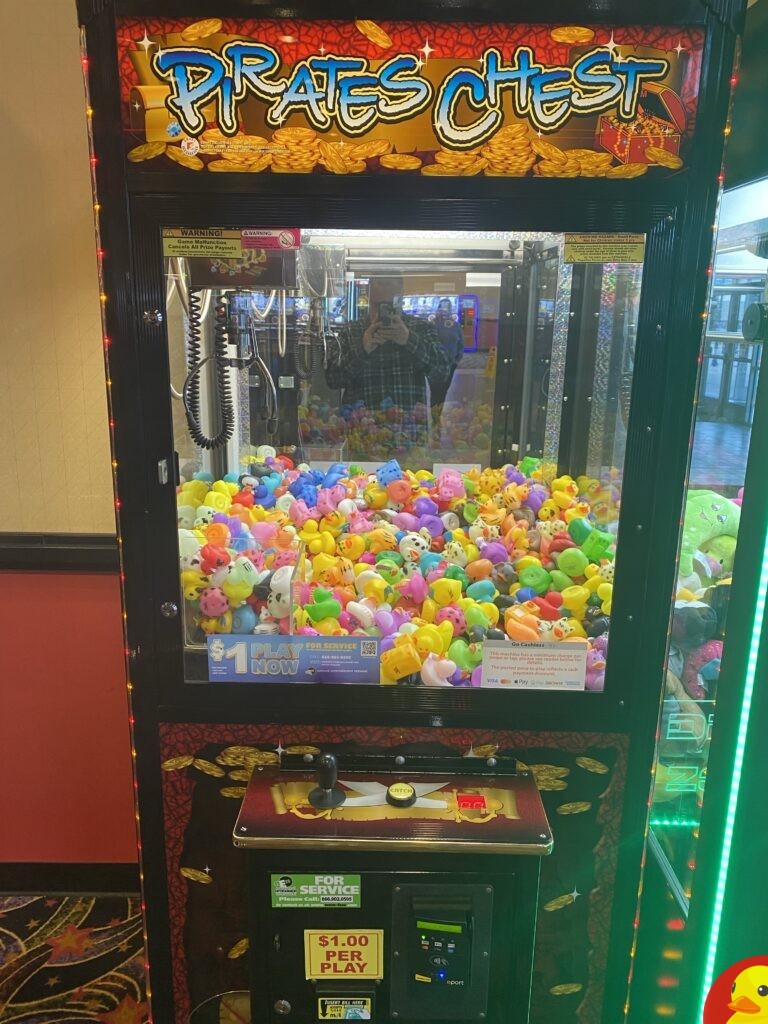 This is a $1.00 one play rubber duck claw machine. I tried it and didn’t win. I’ll stick to the play till you win claw machines. ​It is located inside the AMC inside of College Square Mall.